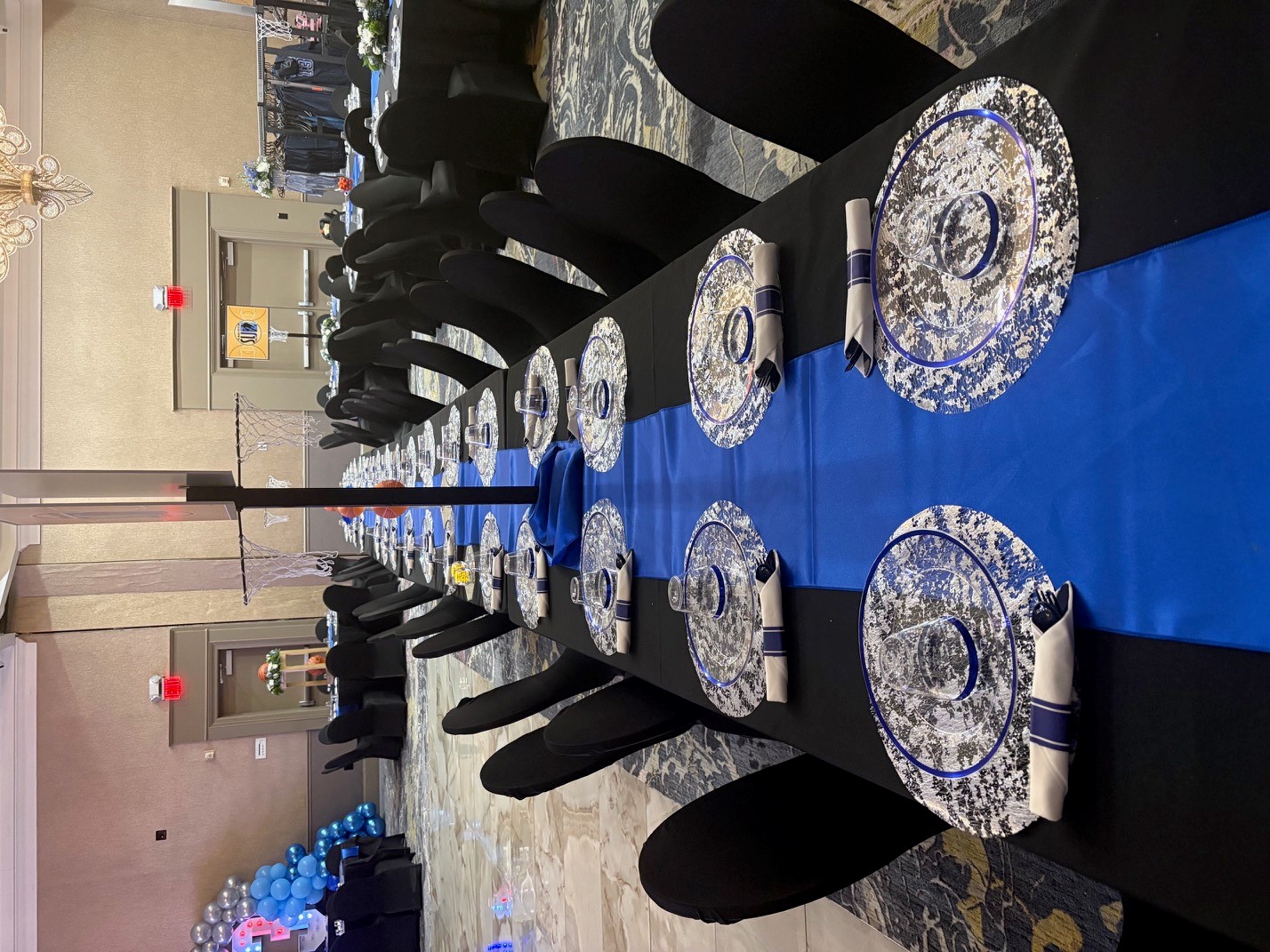 Elegant blue and black banquet table setting